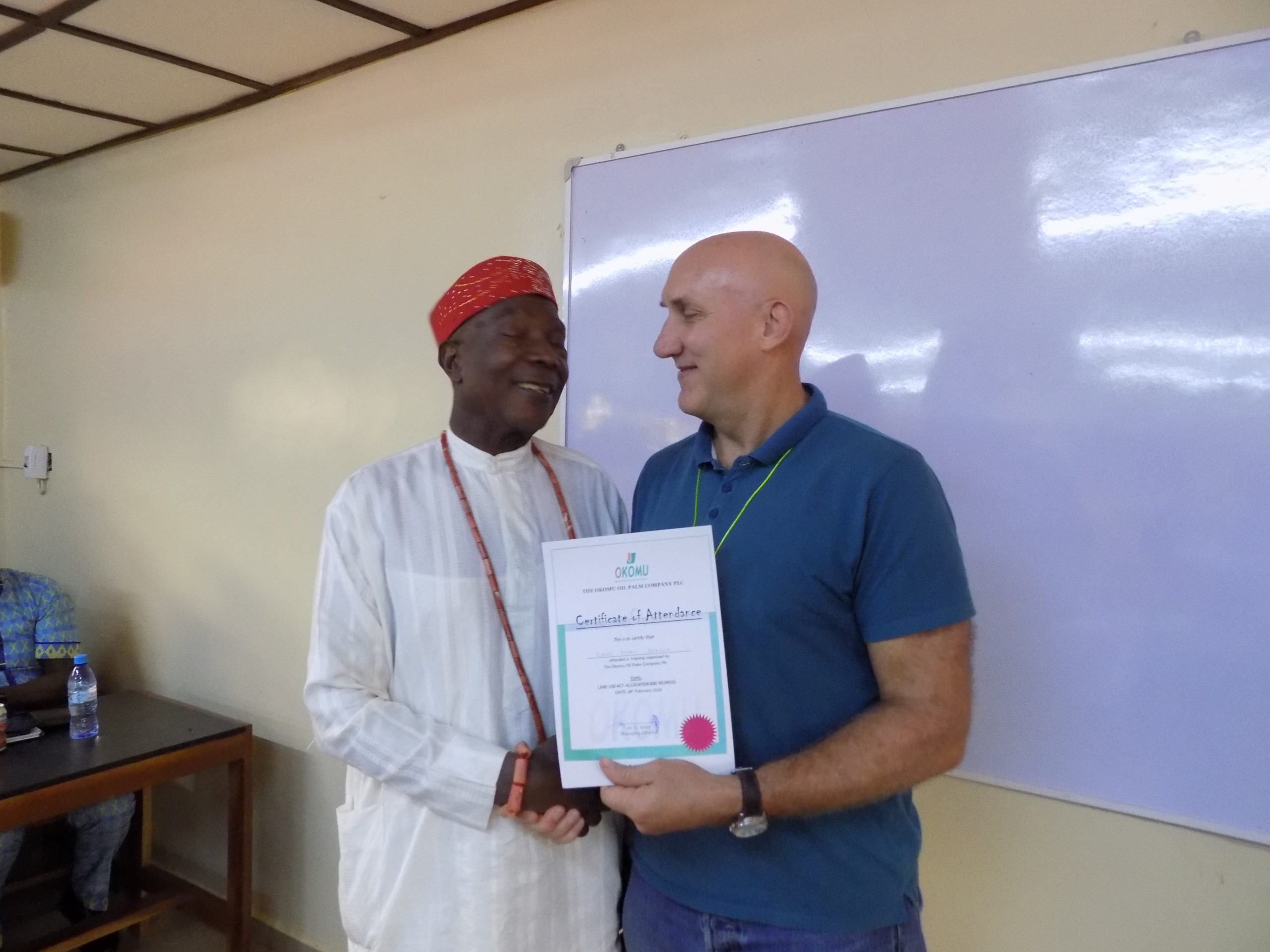 2019 Chief Isaac Osasuyi receives his training certificate from Okomu’s Managing Director, Nigeria